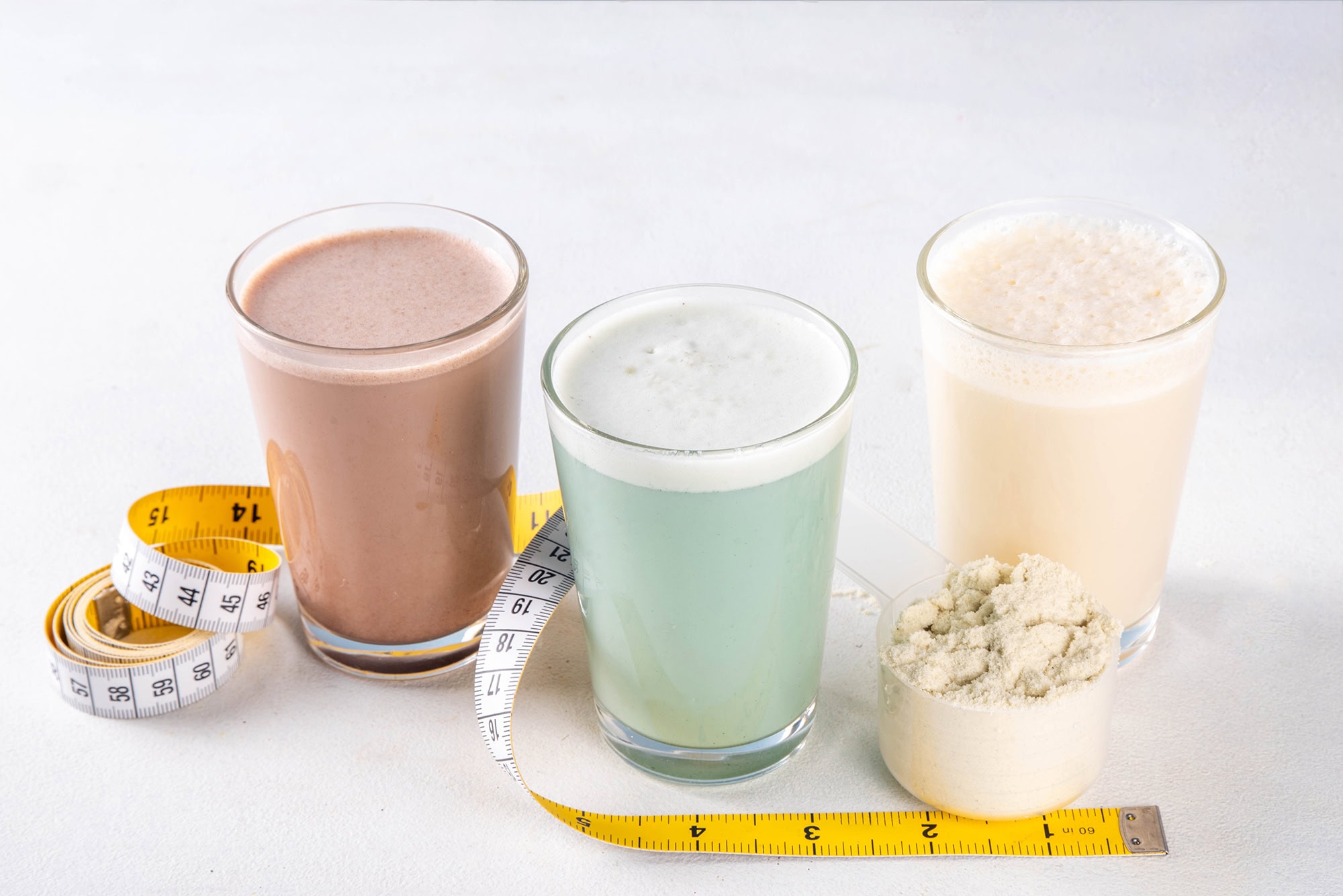 Protein shakes and protein powder with measuring tape for weight loss